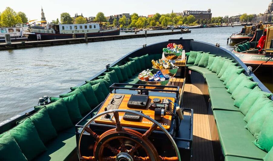 Amsterdam: Guided Open Boat Cruise Unlimited Drinks Option - Around the West Side: Westerkerk, Anne Frank House, and Canal Life at Water Level