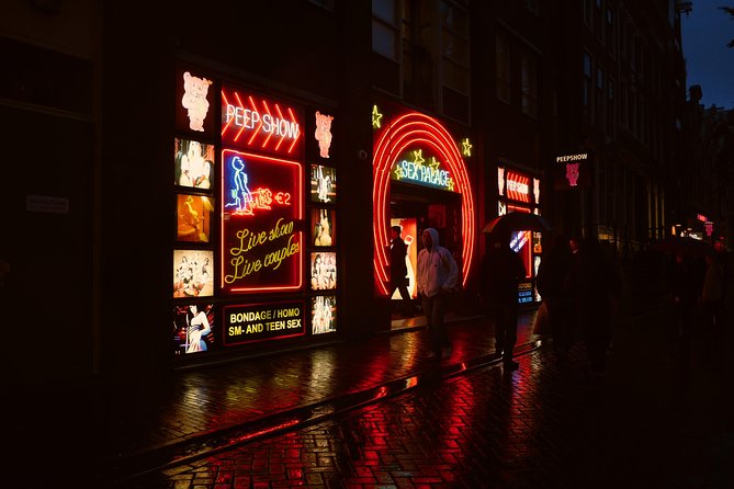 Amsterdam: Guided Red Light District and City Walking Tour - Dam Square and the city built on wooden poles