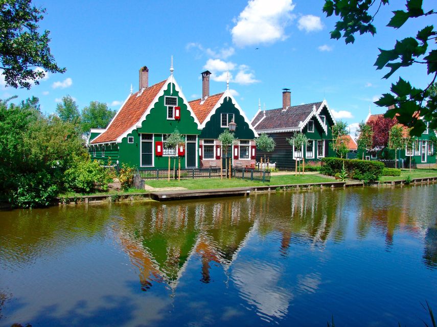 Amsterdam: Guided Zaanse Schans, Windmills & Cheese Tour - The bus ride out of Amsterdam: learning the Zaan region fast