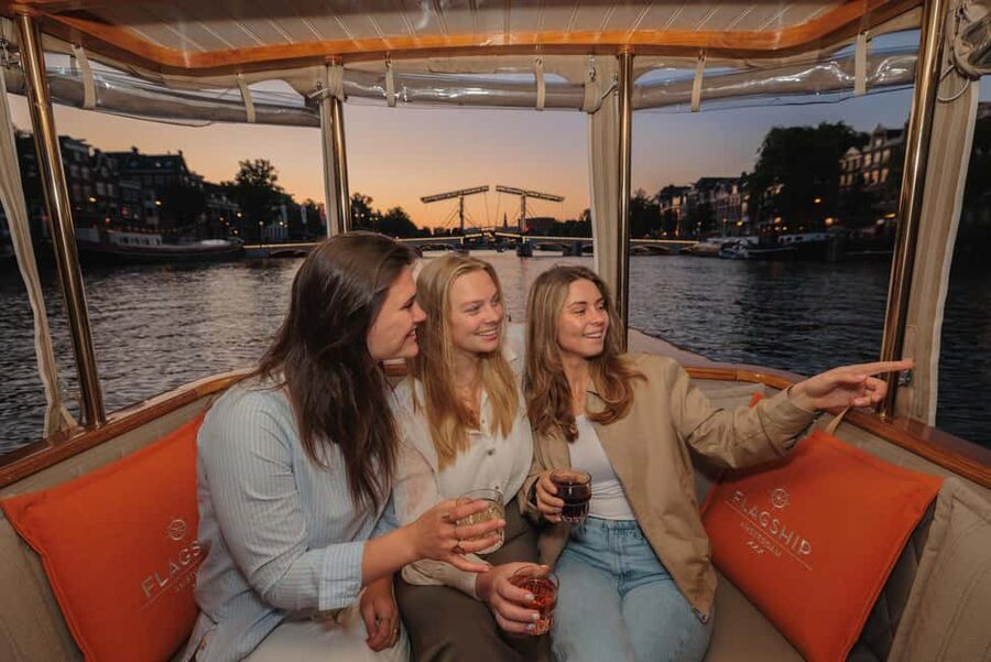 Amsterdam: Heated Canal Cruise with Unlimited Drinks & Bite - Entering Amsterdam’s Waterline: What the Boat Experience Is Like