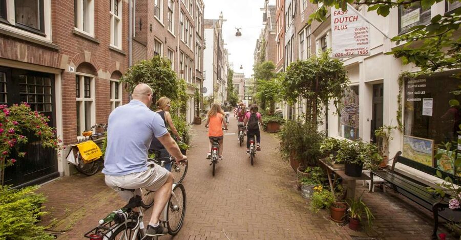 Amsterdam: Hidden Gems & Highlights Guided Bike Tour - Why Amsterdam on two wheels feels like the real city