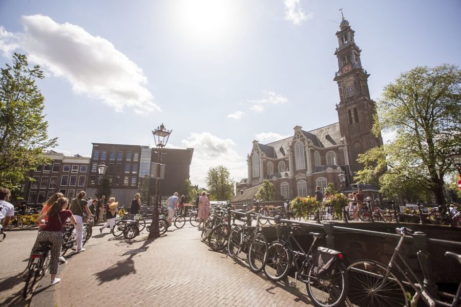 Amsterdam: Hidden Gems & Highlights Guided Bike Tour - Jordaan backstreets, courtyards, and Canal Ring crossings