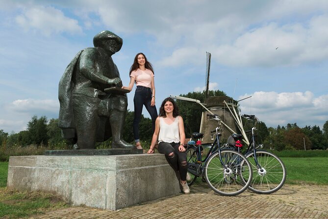 Amsterdam Highlights Bike Tour - Guided in EN/ES/DE/NL - Guide style, language options, and what you should expect to hear