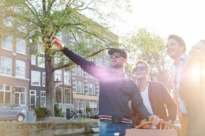 Amsterdam Highlights Canal Cruise with a Drink - Passing the Skinny Bridge and Old Town Architecture From the Canal Level