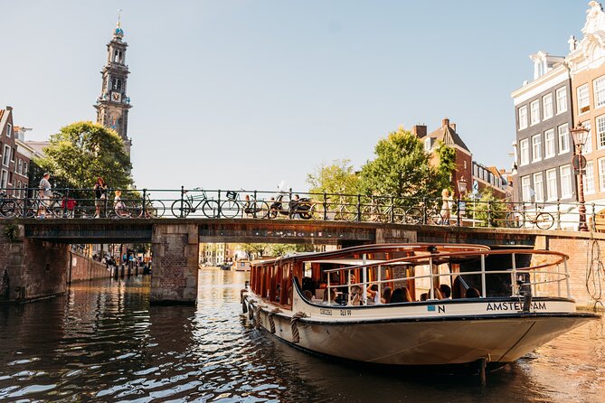 Amsterdam Historic Tour On Classic Saloon Boat - Classic saloon comfort, blankets, and the onboard bar reality