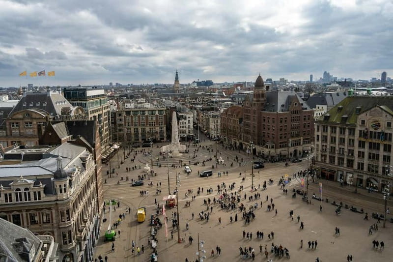 Amsterdam: Iconic Canals & Historic Sights Walking Tour - Canal streets and bridges: why Amsterdam feels walkable but moves like a bicycle city