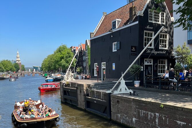 Amsterdam Luxury Boutique Boat tour with Unlimited Beer and Wine - Magera Brug (Skinny Bridge): the photo spot with a story