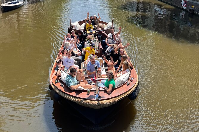Amsterdam Luxury Boutique Boat tour with Unlimited Beer and Wine - Guide style and small-group energy: what makes it feel personal