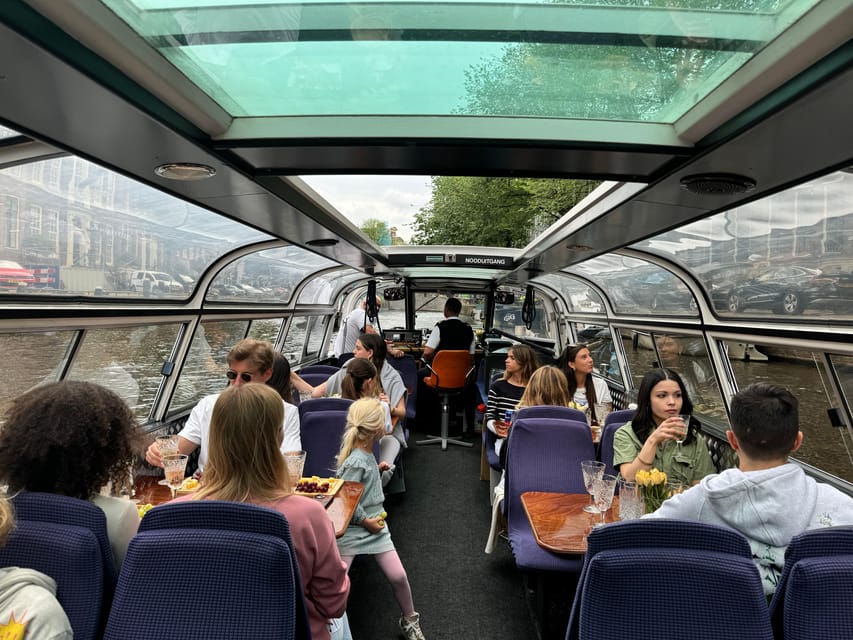 Amsterdam: Luxury Cheese & Wine Canal Cruise - The guide experience, including Alex and English or Dutch narration