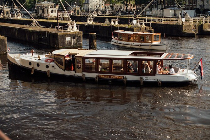 Amsterdam: Luxury Saloon Boat Cruise with Cocktails & Waffle - Where you meet and how often it runs