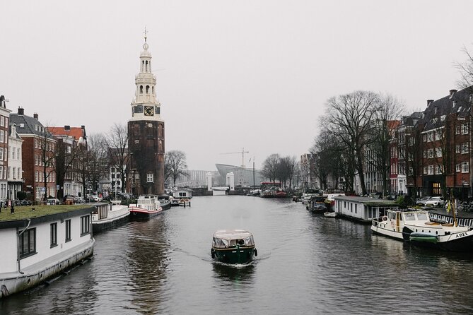 Amsterdam Newest Canal Cruise with local guide and small group - A 1-hour canal reset that starts where you already are
