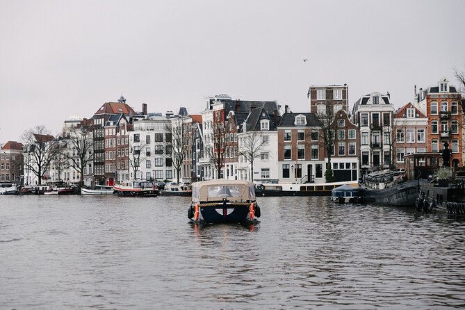 Amsterdam Newest Canal Cruise with local guide and small group - Zeedijk and the contrast between old defenses and modern streets