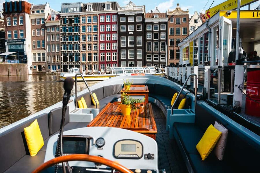 Amsterdam: Open Boat Canal Cruise (with Free Spritz Option) - The onboard vibe: small open boat comfort, outdoor seating, and how to enjoy it