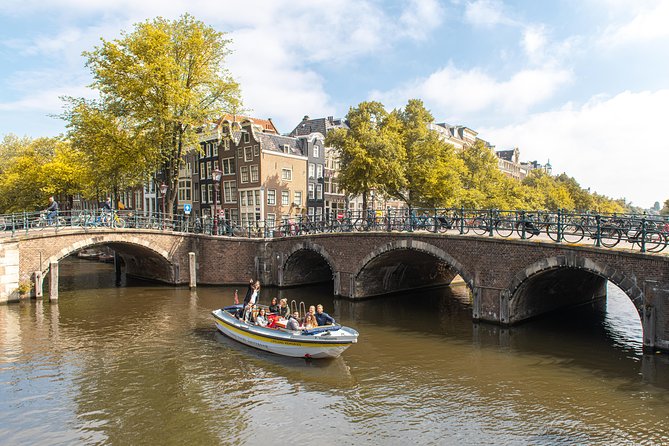 Amsterdam Open Boat Tour with Local Guide - A 1-Hour Canal Float That Lets You Hear Amsterdam
