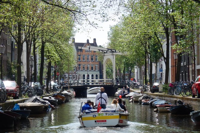 Amsterdam Open Boat Tour with Local Guide - Sailing Through Historic Canals: What the Captain Really Adds