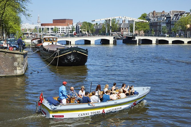 Amsterdam Open Boat Tour with Local Guide - The Bridge of Love Underpass Moment