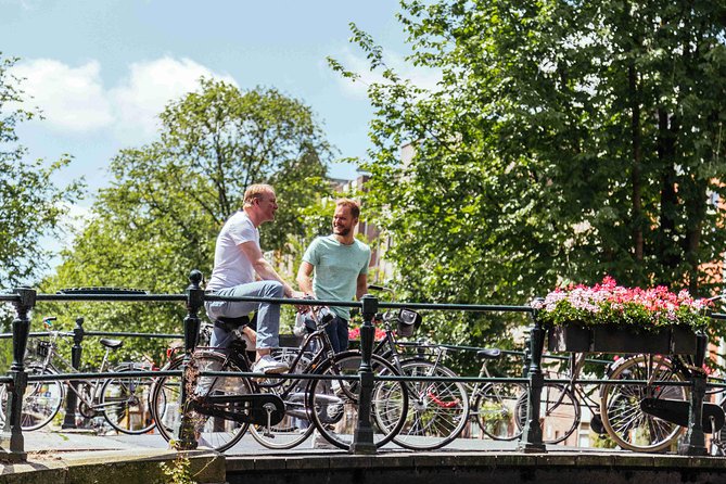 Amsterdam PRIVATE Bike Tour With Locals: Bike & Local Snack Included - A private local host who actually tailors the day
