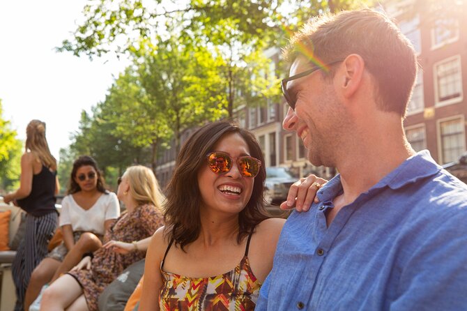 Amsterdam Private Boat Trip with Pizza and Unlimited Drinks - The full canal route: major landmarks, museums, and Amsterdam details in 90 minutes