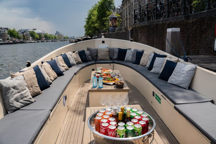 Amsterdam: Private Canal Booze Cruise with Unlimited Drinks - Meeting at Amstel 178 and Boarding the Starboard Boat