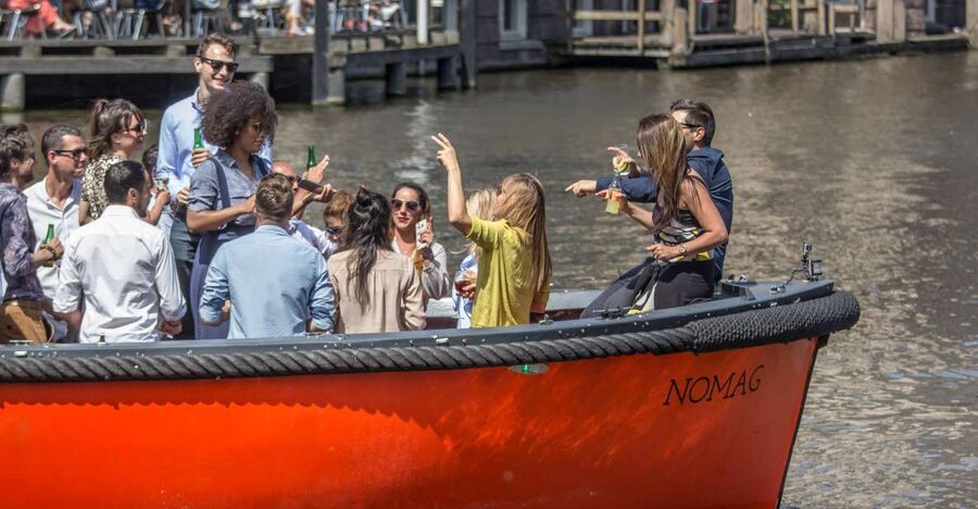 Amsterdam: Private Prosecco Canal Cruise Tour - The boat vibe: silent lifeboat, clean setting, and group-first fun