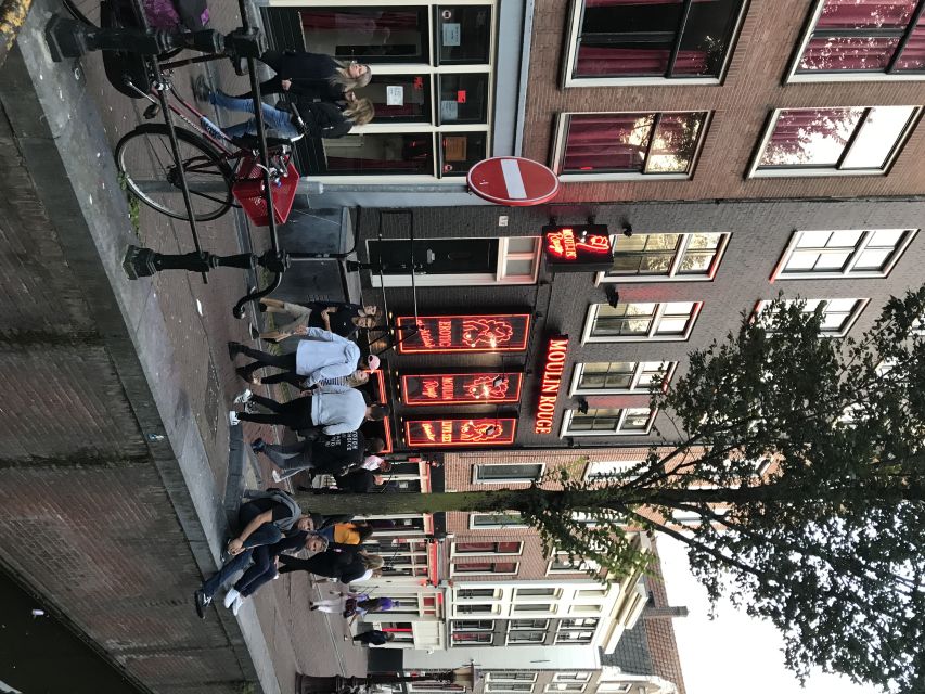 Amsterdam: Private Red Light District and Food Tour - Flower Market area and the Dam Square finish