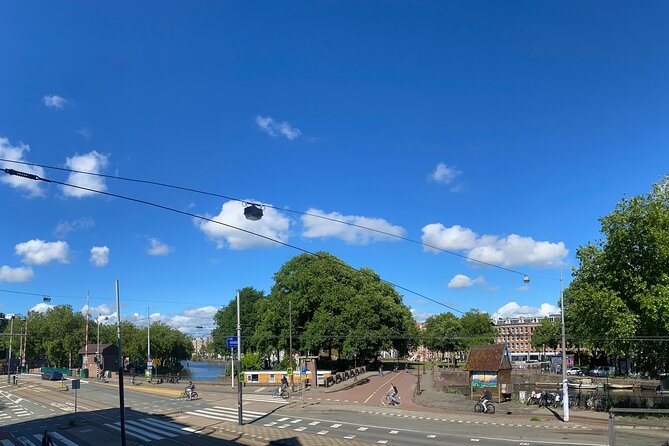 Amsterdam Private Walking Tour with Dinner Experience - Jacob Catskade and the canal view from the apartment balcony