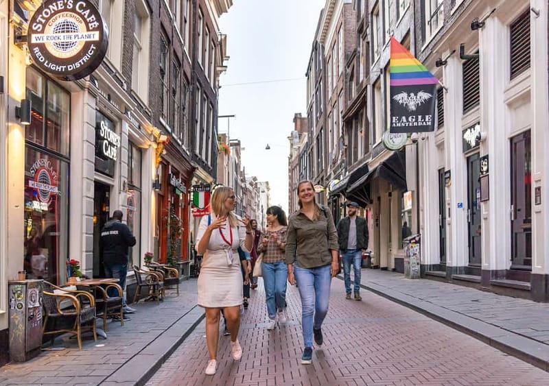 Amsterdam: Red Light District Tour in DE/EN/IT/ES/FR - Dam Square to Condomerie: starting with history, not just the headlines