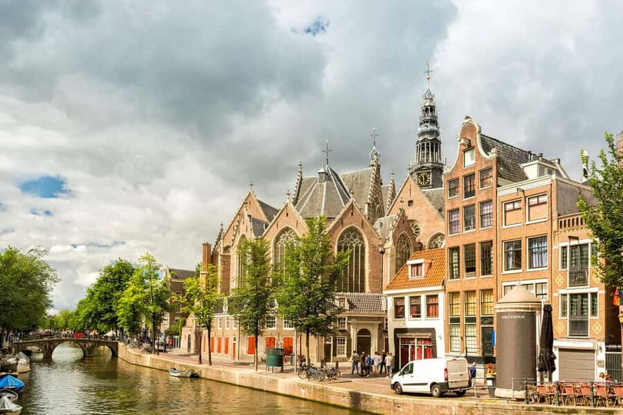Amsterdam: Red Light District Tour in English or German - Red-lit windows, neon signs, and the law explained