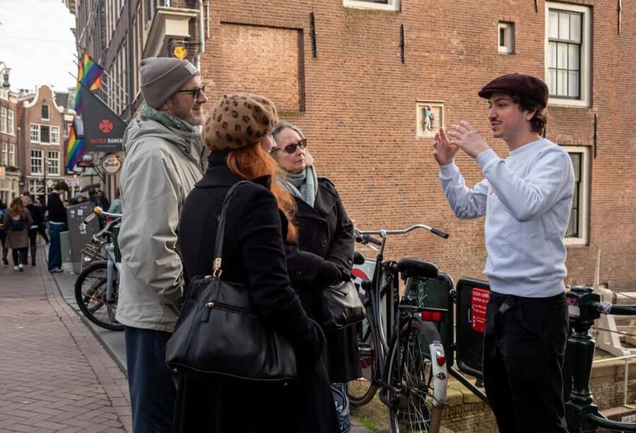 Amsterdam: Red Light District Tour in English or German - Alleyway stops, Condomerie, and the narrowest street