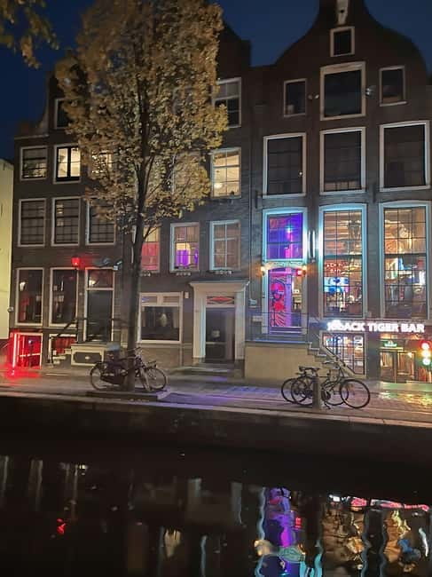 Amsterdam: Red Light District Tour in German/English for groups of 4 or more - Starting by St. Nicholas, Then Crossing Into Amsterdam’s Layers