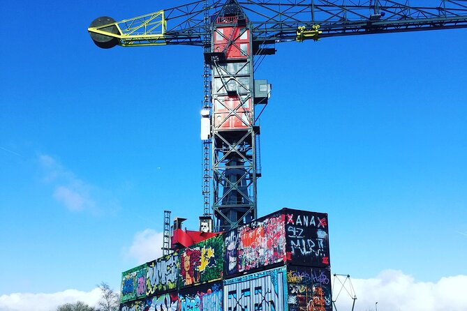Amsterdam's Hidden Gems and Street Art Bike Tour - NDSM Wharf: industrial ramps, big ship halls, and street art