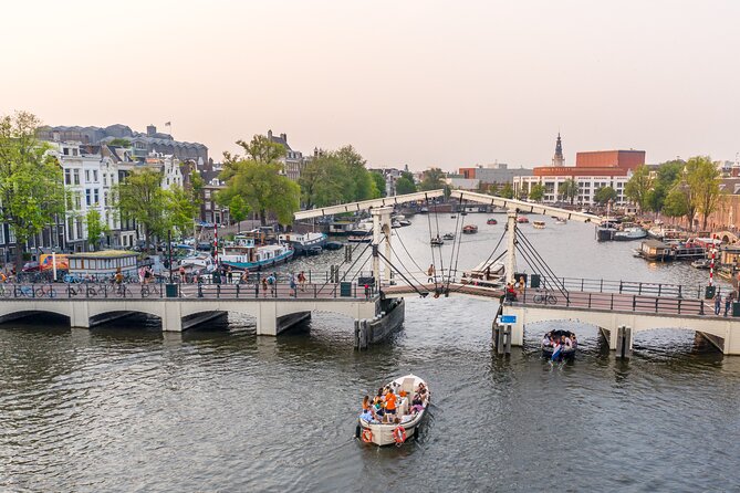 Amsterdam: Saloon Boat Cruise + Unlimited Drinks & Bite option - Seeing many bridges at once: the rare canal trick