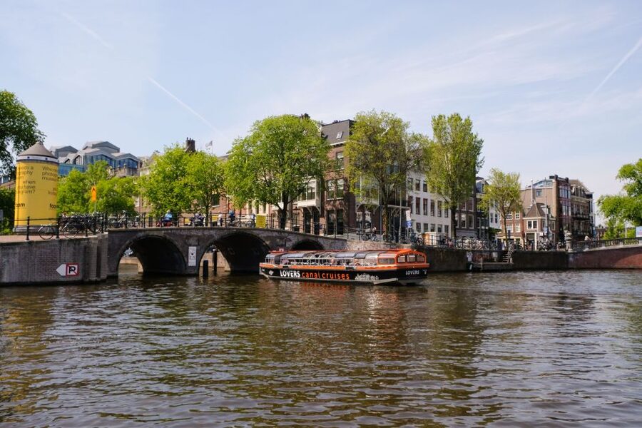 Amsterdam: Semi-Open Canal Boat Cruise - Semi-Open Roof Comfort in Real Amsterdam Weather