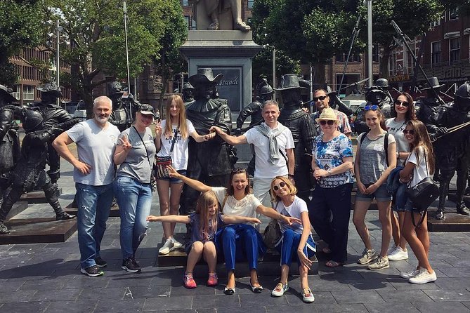 Amsterdam Sightseeing Tour + Hidden Gems + Tastings + PDF guide - Bloemenmarkt floating flowers, Munttoren details, and the math of Dutch history