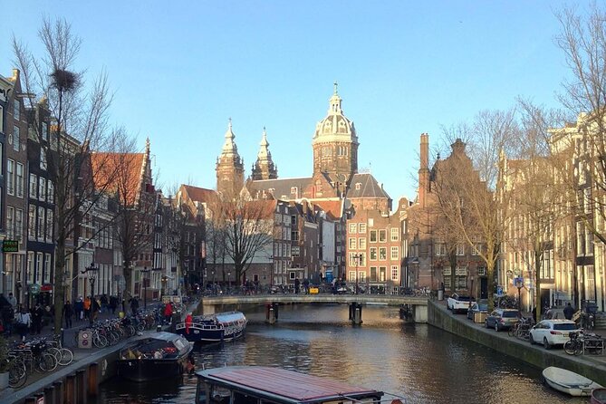 Amsterdam Sightseeing Tour + Hidden Gems + Tastings + PDF guide - Damrak tastings, cheese and stroopwafels, plus what Dam Square really means