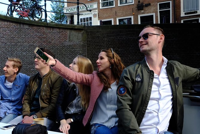 Amsterdam Small-Group Canal Cruise Including Snacks and Drinks - Entering Amsterdam by water, starting at Keizersgracht