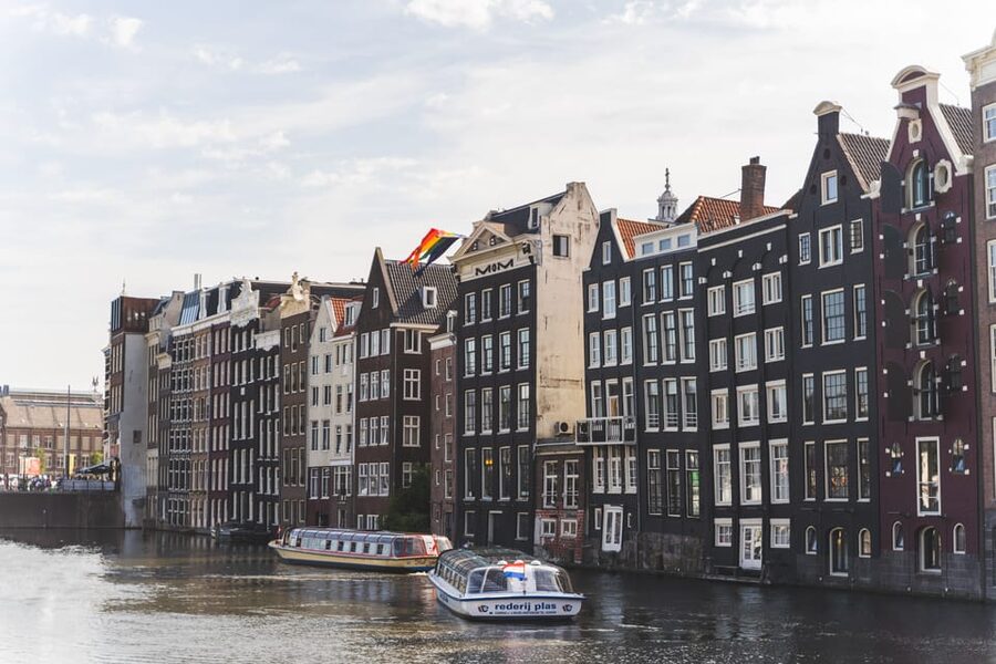 Amsterdam Small-Group Walking Tour with Canal Cruise - The Canal Cruise Part: Audio Views or Luxury Open Boat With a Bar