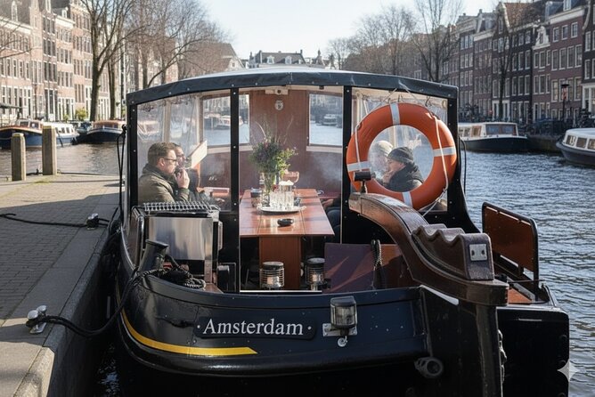 Amsterdam Smoke Friendly Cruise with drinks option & local guide - Nemo and the maritime area: modern landmarks with canal-side charm