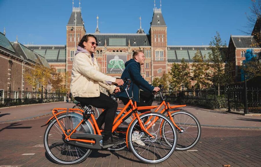 Amsterdam: Top Highlights Guided Bike Tour - From Red Light District pass-by to UNESCO canals, the city’s “real center” moments