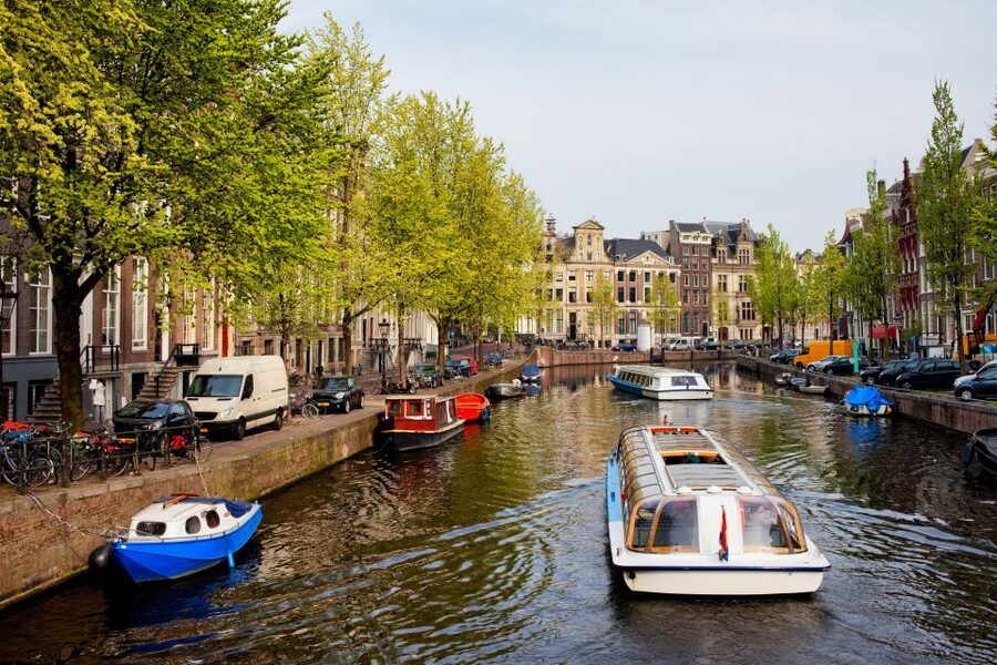 Amsterdam Walking Tour and Canal Cruise - Jordaan streets, Dam Square, and the West Church near Anne Frank’s House