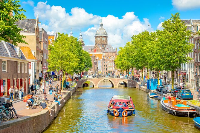 Amsterdam Walking Tour & Canal Cruise with Drink & Cheese Tasting - Dam Square as the finish line: landmarks, monuments, and the center of it all