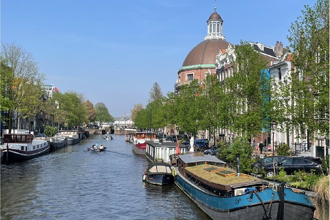 Amsterdam Walking Tour: Explore the Red Light District - Stop 3: Amstel River, mills, and why the city’s name makes sense