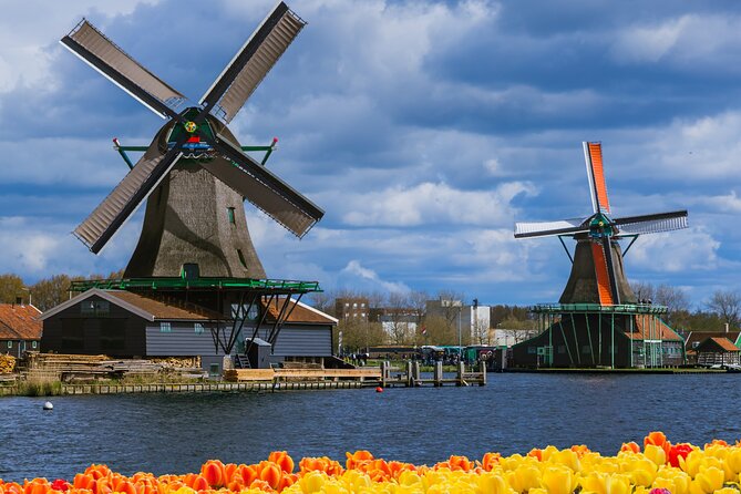 Amsterdam: Windmills, Cheese and Volendam Tour with Video Guide - Zaanse Schans windmills: photos, canals, and a clog workshop