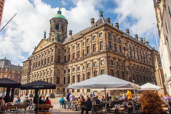 Anne Frank Walking Tour Amsterdam - Stop 2: Nieuwezijds Voorburgwal 120 and the feel of canal-center Amsterdam
