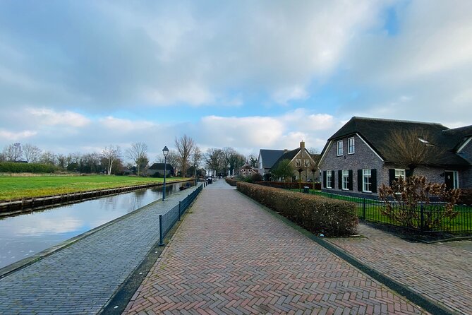 Day Tour Giethoorn, Afsluitdijk and Zaanse Schans with Boat Cruise - Afsluitdijk photo stop with renovation limits
