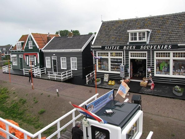 Day Trip to Zaanse Schans, Edam, Volendam and Marken from Amsterdam - Stop 1: Zaanse Schans windmills, wooden houses, and countryside views