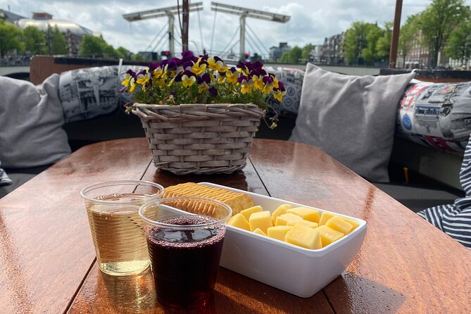 Dutch Cheese & Drinks Guided Amsterdam Boat Tour, All Inclusive - Oude Kerk and the Red Light District, seen from the water