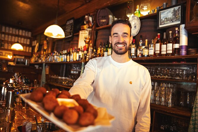 Eating Amsterdam: Albert Cuyp Market & The Pijp Food Tour - Simon Meijssen saucijzenbroodje, a bakery stop with pedigree