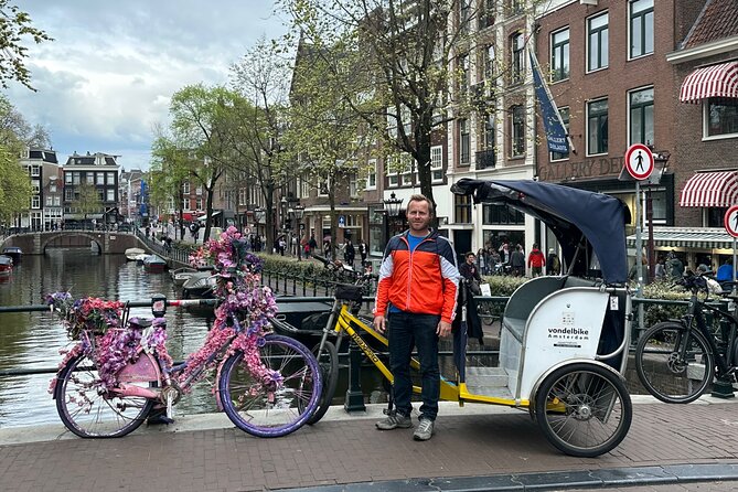 Explore Amsterdam in 75 Minutes – Pedicab Rickshaw City tour - Magere Brug, the Skinny Bridge: a 5-minute payoff with big views