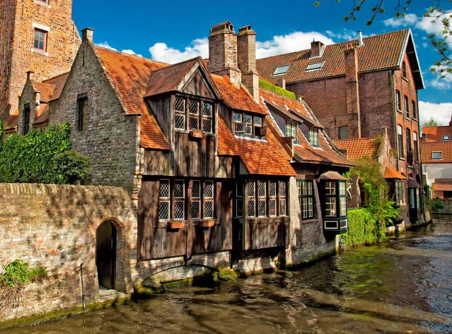 From Amsterdam: Bruges Day Tour in Spanish or English - The big icons: Béguinage, Holy Blood Basilica, Belfry, and Market Square